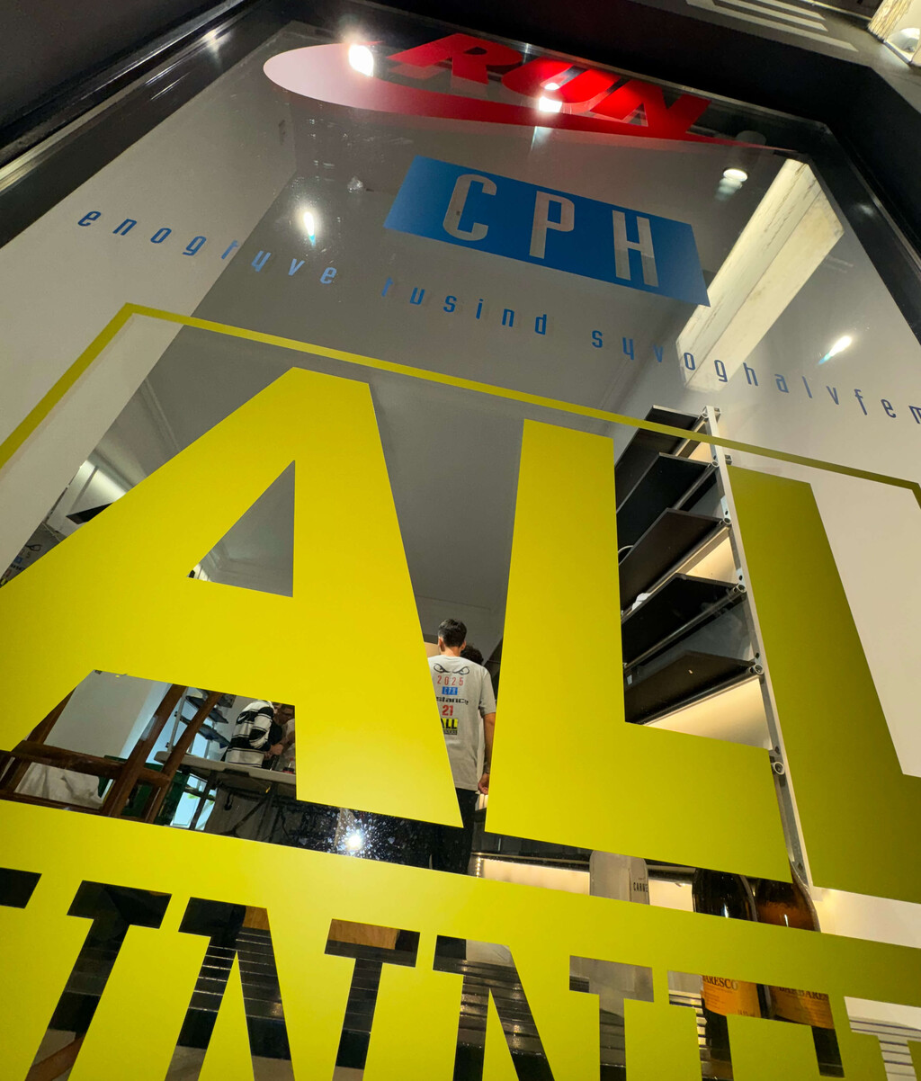 visual identity for Nike + Distance take-over during CPH Half marathon 2025. 
Stickers, windows, venue signage, merch and special t-shirt - © Axel Pelletanche